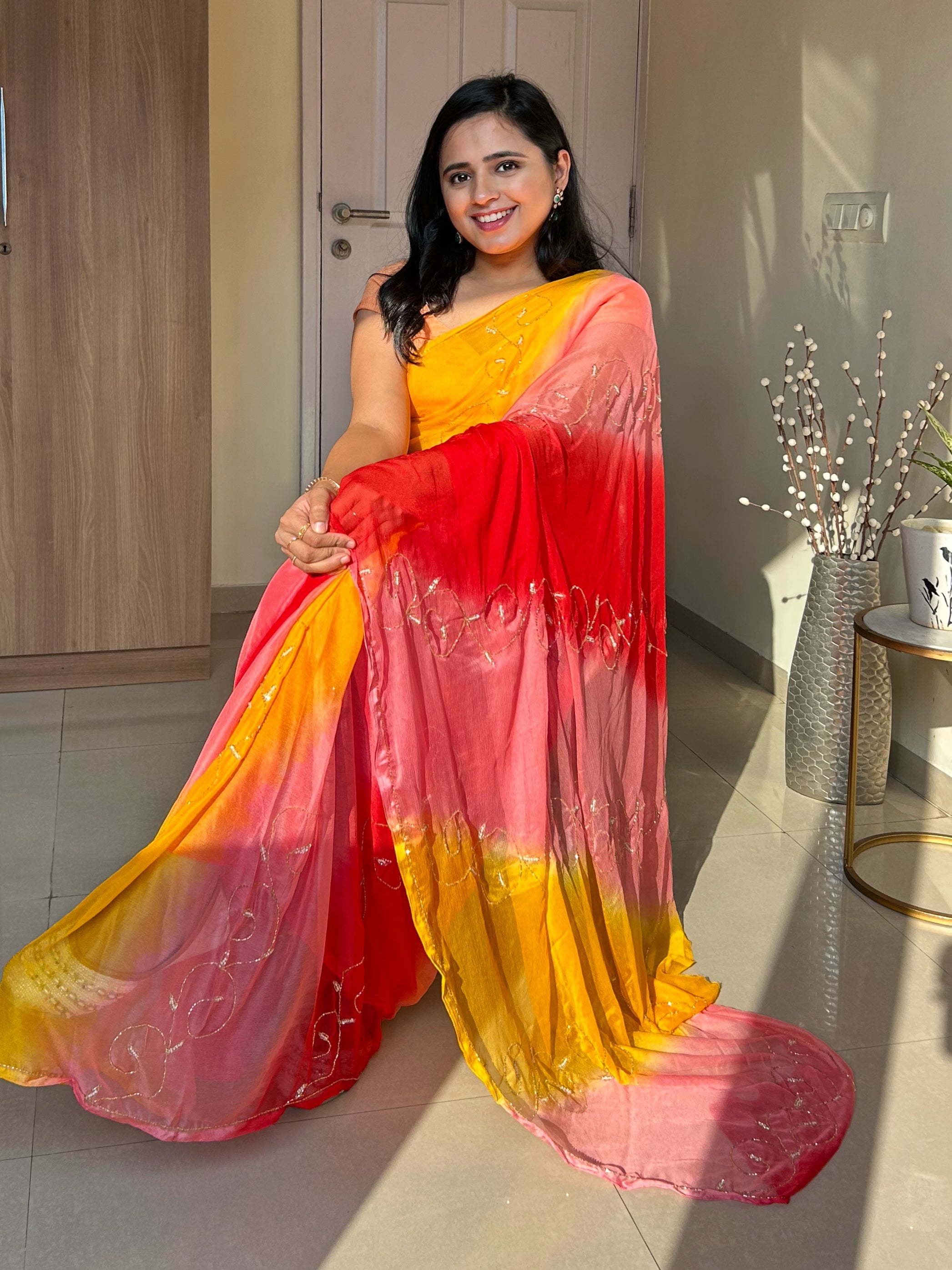 Saree Is In Yellow, Blue And Red Combination